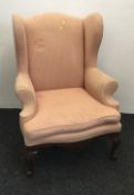 A 19th century wing back armchair