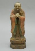 A Chinese painted wooden figure