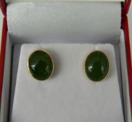 A pair of 14 ct gold jade earrings