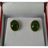 A pair of 14 ct gold jade earrings
