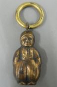 A brass rattle formed a Dutch boy