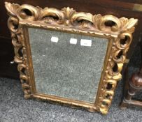 A 19th century carved giltwood wall glass