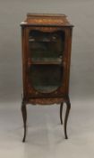 A Victorian inlaid mahogany vitrine