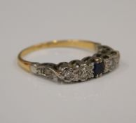 A gold five stone diamond and sapphire ring (2 grammes total weight)