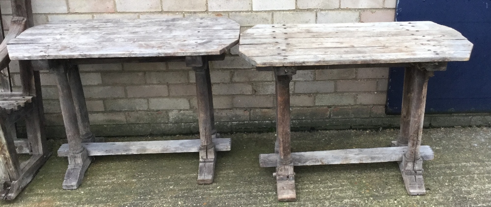 A pair of wooden garden tables