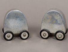 A pair of 1960s polished aluminium cruets, each wheeled, one inscribed Salt 4 Me,