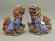 A pair of Chinese pottery dogs-of-fo