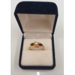 An 18 ct gold diamond and sapphire ring (3.