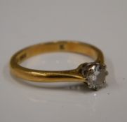 An 18 ct gold diamond solitaire ring (2.