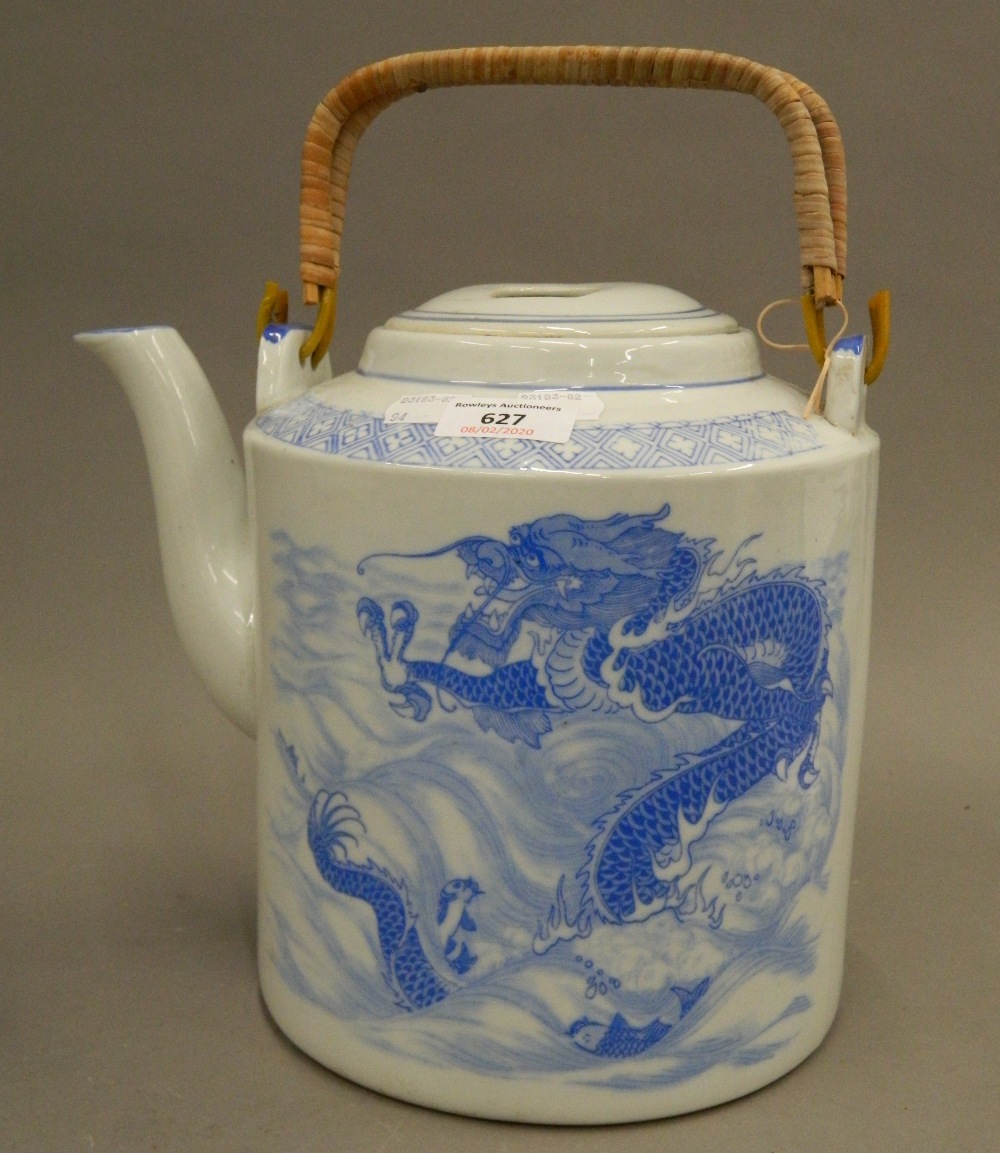 A large blue and white teapot