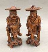 A pair of Chinese carved wooden figures