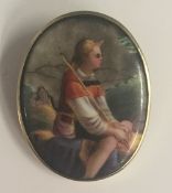 A Victorian painted porcelain brooch