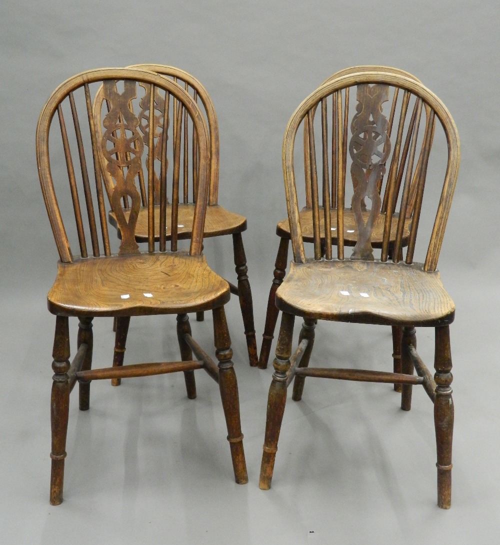 A set of four late 19th century wheelback chairs