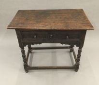 An oak single drawer side table