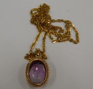 A 9 ct gold amethyst pendant on chain (4.