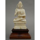 A late 19th century Chinese carved ivory model of Buddha