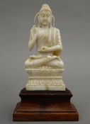 A late 19th century Chinese carved ivory model of Buddha