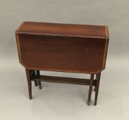 An Edwardian mahogany Sutherland table