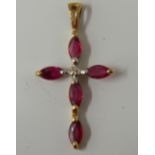 A 9 ct gold diamond and ruby crucifix (0.