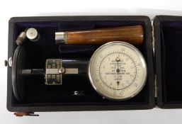 A cased Bateman's speedometer