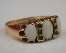 A 9 ct gold opal and emerald ring (3.