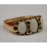 A 9 ct gold opal and emerald ring (3.