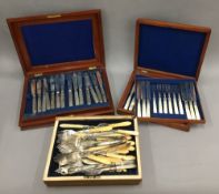 A quantity of cased plated cutlery