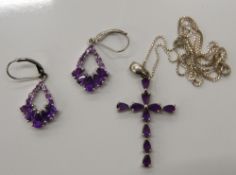 A pair of silver stone set earrings and a silver stone set cross on chain