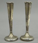 A pair of silver bud vases