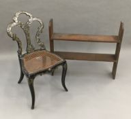 A Victorian mother-of-pearl inlaid cane seated bedroom chair and an oak hanging shelf