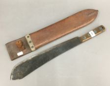 A vintage machete in a leather sheath