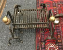 A 19th century fire grate and a pair of fire dogs