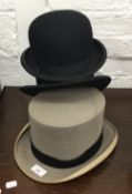 Two bowler hats and a grey top hat