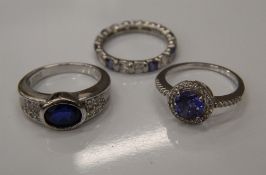 Three silver stone set rings