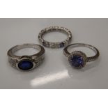 Three silver stone set rings