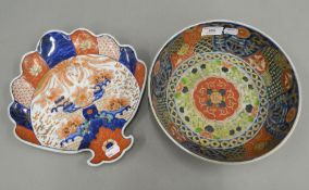 A late 19th century Imari bowl and an Imari fan shaped plate