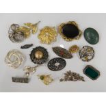 A collection of various brooches