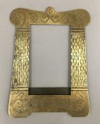 A brass Trench Art photograph frame