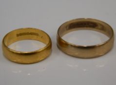 A 22 ct gold wedding band (3.7 grammes) and a 9 ct gold wedding band (2.