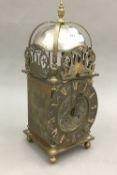 An 18th century style brass lantern clock