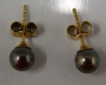 A pair of 9 ct gold and black pearl earrings