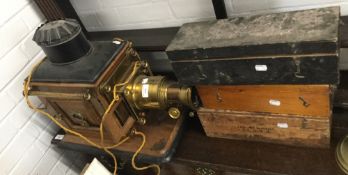 A Victorian magic lantern projector and a quantity of slides