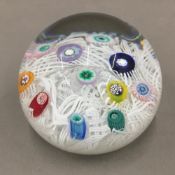 A millefiori glass paperweight