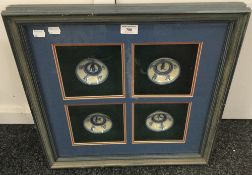 Four Oriental blue and white porcelain bowls housed in a common box frame