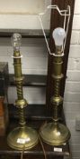 A pair of ecclesiastical style brass table lamps