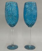 A pair of large glass goblets