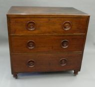 A small mahogany chest of drawers