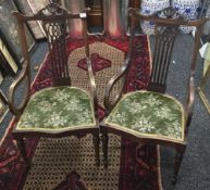 A pair of Edwardian mahogany open armchairs