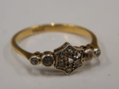 An 18 ct gold diamond set ring (1.