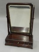 A 19th century mahogany toilet mirror